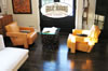 Comfortable sitting room with dark hardwood floors