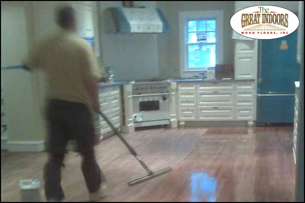 Indianapolis wood floor refinishing company Great Indoors Wood Floors applying polyurethane to a wood floor