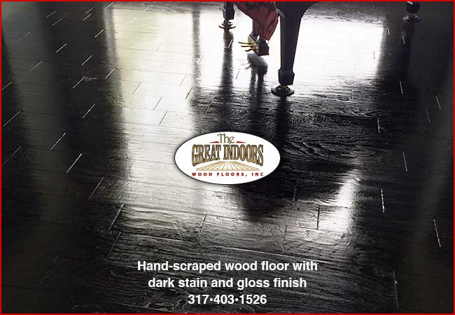 hand-scraped wood floor with dark stain and glossy finish