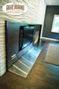 Modern stainless steel fireplace with adjoning wood floors